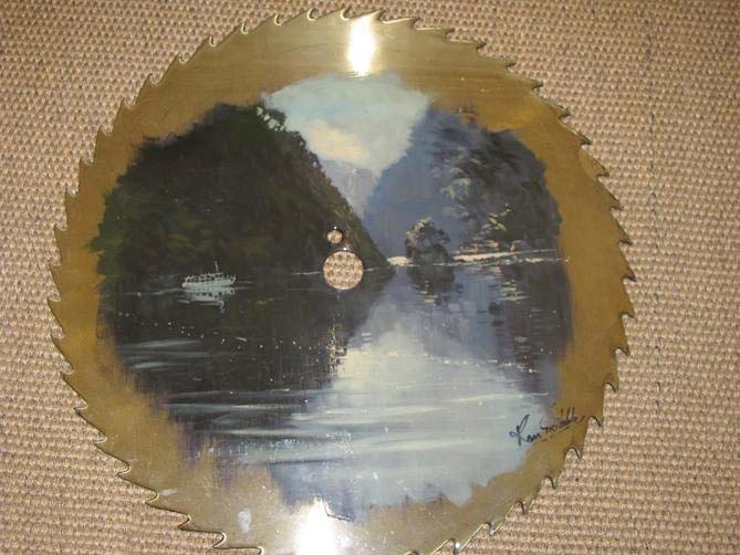 Painting by Ron Gribble on a skill saw blade